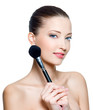 woman  with make-up brushe for applying  rouge