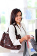 Beautiful modern woman buying with credit card Beautiful modern woman buying with credit card
