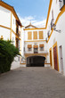 Typical alley from Sevilla, Spain. La Maestranza bullring Typical alley from Sevilla, Spain. La Maestranza bullring