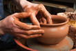 hands of a potter, creating an earthen jar on the circle hands of a potter, creating an earthen jar on the circle