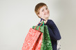 Happy redhead woman with shopping bags
