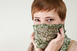 Green eyed redhead woman with scarf
