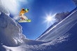 Snowboarder jumping against blue sky