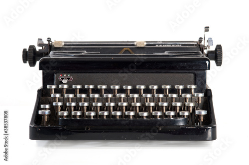 Photo: Vintage black typewriter isolated on white background. Vintage black typewriter isolated on white background.