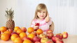 Child drinking juice and showing Ok!