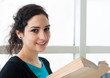 Portrait of a student reading a book