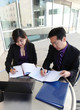 Chinese Man and Woman on Computer