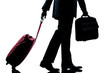 business traveler man walking with handbag and  suitcase