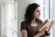 Portrait of a student reading a book