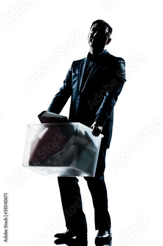 Photo: silhouette man full length fired carrying heavy box silhouette man full length fired carrying heavy box