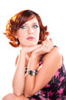 portrait of attractive dreaming red haired girl over white