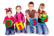 Happy kids holding blocks with numbers