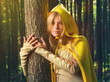 Blond girl in a magic forest