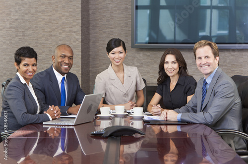 Photo: Interracial Men & Women Business Team Meeting in Boardroom Interracial Men & Women Business Team Meeting in Boardroom