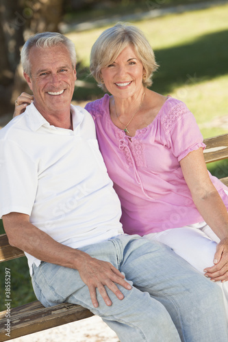 Photo: Happy Senior Couple Smiling Outside in Sunshine Happy Senior Couple Smiling Outside in Sunshine