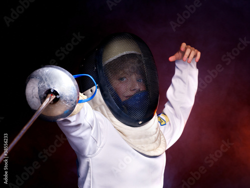 Photo: Child epee fencing lunge. Child epee fencing lunge.