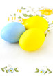 Foto: Three multi colored eggs on a napkin. Three multi colored eggs on a napkin.