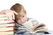 The boy reads the book isolated on white