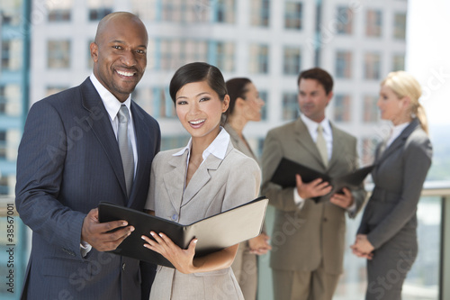 Photo: Interracial Men & Women City Business Team Interracial Men & Women City Business Team