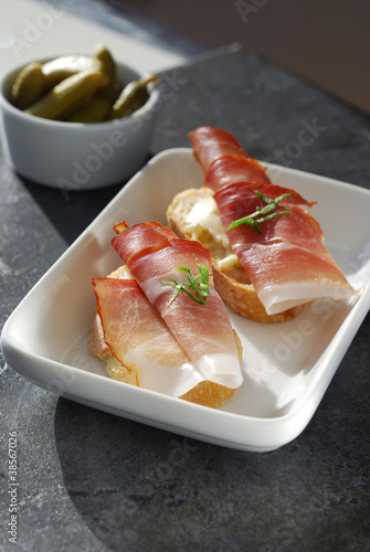 Photo: Ham Crostini with cornichons on slate Ham Crostini with cornichons on slate