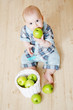 little boy with a basket of apples