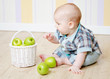 little boy with a basket of apples