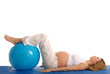 pregnant woman practicing yoga with blue ball