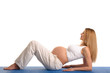 pregnant woman lying down and practicing yoga