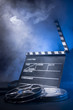 Photo: movie clapper and film reels movie clapper and film reels