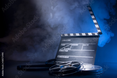 Photo: movie clapper and film reels movie clapper and film reels