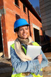 Architect on building site using electronic tablet Architect on building site using electronic tablet
