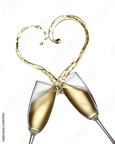 Photo: Champagne splash in shape of heart isolated on white Champagne splash in shape of heart isolated on white