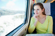 Young woman traveling by train