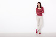Woman against a white wall