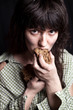 beggar woman eating bread