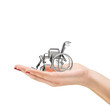 Woman's hand holding a wheelchair