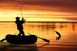 Fishermen in boat at sunset