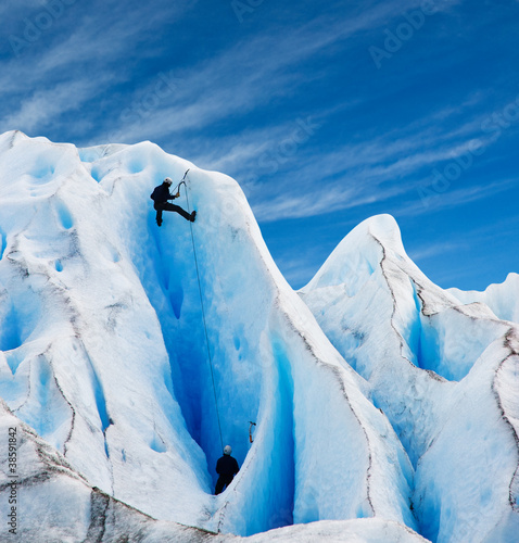 Photo: Two men climbing a glacier in patagonia. Two men climbing a glacier in patagonia.