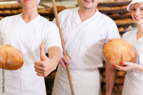 Photo: Baker with his team in bakery Baker with his team in bakery