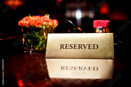 Photo: Reserved sign in restaurant Reserved sign in restaurant