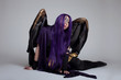 girl sit in purple fury cosplay costume character