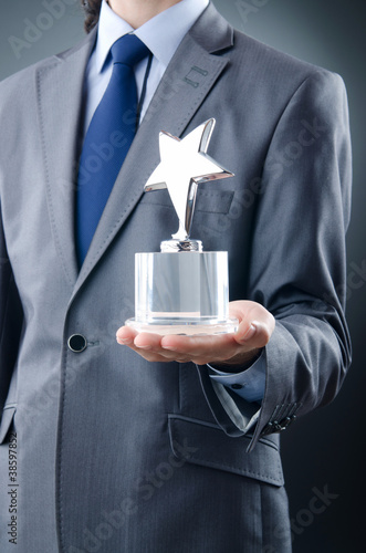 Photo: Businessman awarded with star award Businessman awarded with star award