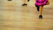 Girl in shoes with taps and pink skirt tap dance