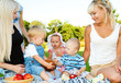 Toddlers and their moms having lunch