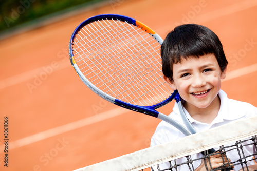 Photo: Boy playing tennis Boy playing tennis