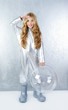 Astronaut girl with silver uniform and glass helmet Astronaut girl with silver uniform and glass helmet