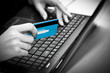 Online shopping with credit card on laptop
