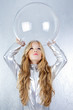 Astronaut girl with silver uniform and glass helmet Astronaut girl with silver uniform and glass helmet