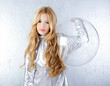 Astronaut girl with silver uniform and glass helmet Astronaut girl with silver uniform and glass helmet