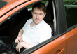 Man in car with netbook
